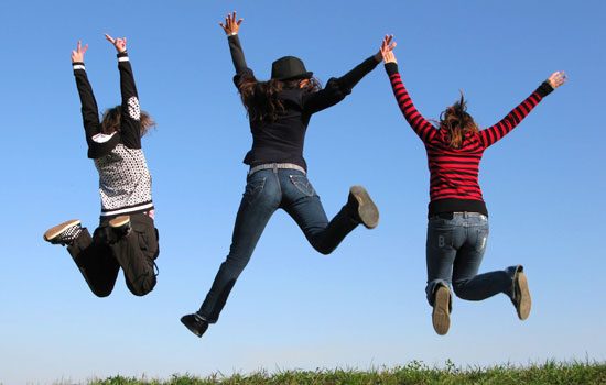 Group of people jumping in the air with joy